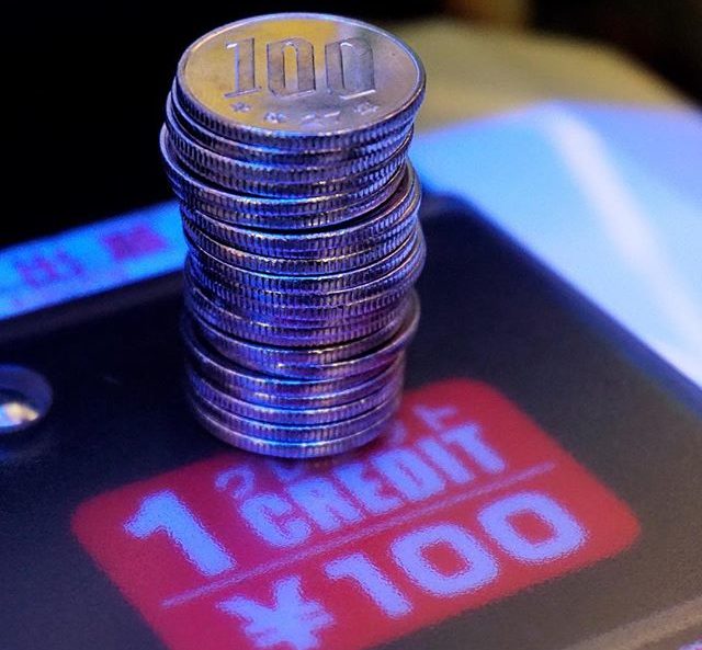 100 yen coins stacked up at HEY Arcade in Akihabara