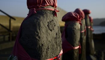 Nagasaki, JAPAN - February 23, 2015: Jizo statues stand on the beach of Iki Island.