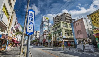 Pedestrians and traffic on International Street. The street is the main thoroughfare and entertainment district of the city.
