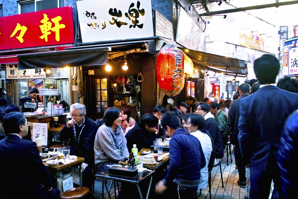 People eating and drinking in an izakaya in Ameya-yokocho, Taito-ku, Tokyo