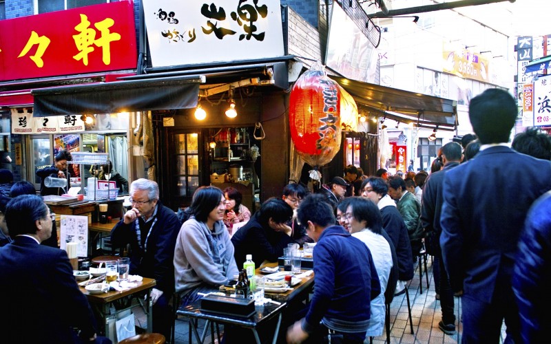 People eating and drinking in an izakaya in Ameya-yokocho, Taito-ku, Tokyo