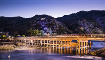 Arashiyama, Kyoto, Japan at Togetsukyo Bridge during the annual autumn light up.