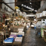 Tokyo, Japan - June 4, 2015: Retailers busy selling and packing seafood in Tsukiji market. It is the largest fish market in Japan.