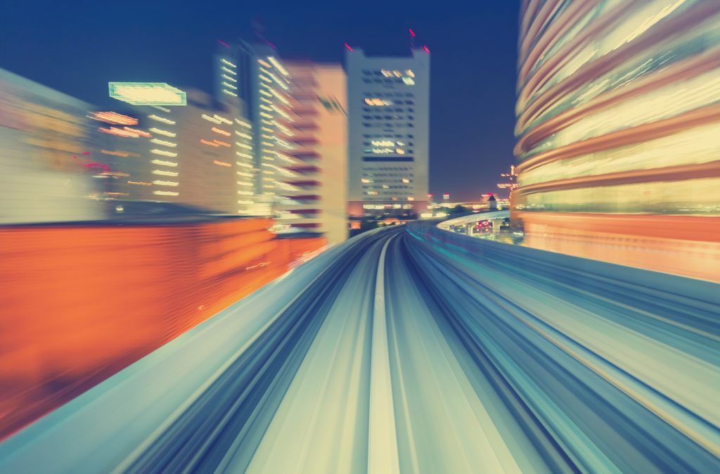 Abstract high speed technology POV motion blurred concept image from the Yuikamome monorail in Tokyo Japan